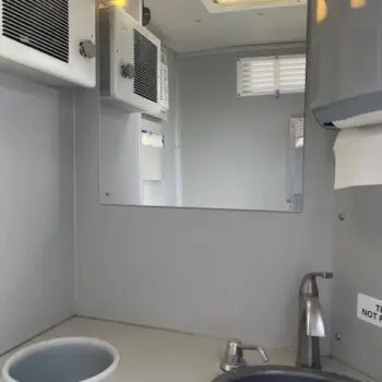 Portable restroom interior with sink
